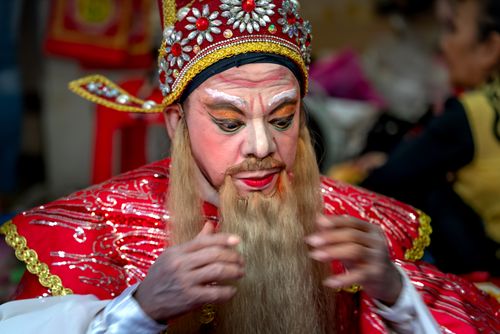 Free Close-up of a traditional opera performer in vibrant costume and makeup, showcasing cultural artistry. Stock Photo