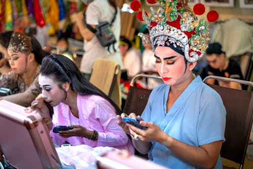 Women Preparing, Wearing Traditional Clothing and Makeup