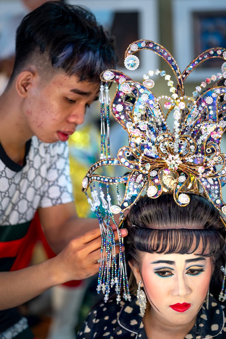 Man Putting Crown On Woman Head