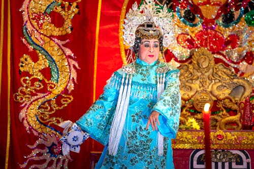 Elderly Woman Performing while Wearing a Traditional Dress