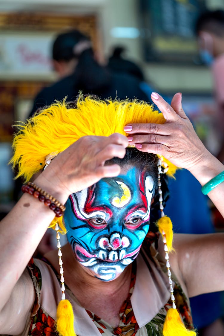 Woman With Painted Face On Carnival