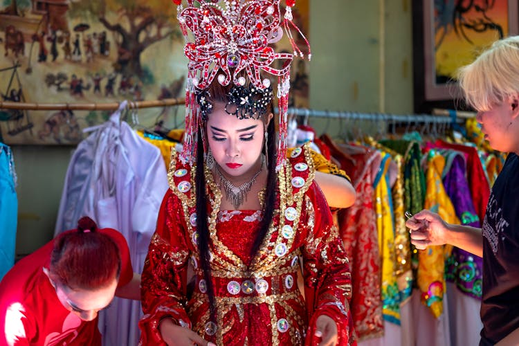 Woman In Traditional Dress In Shop