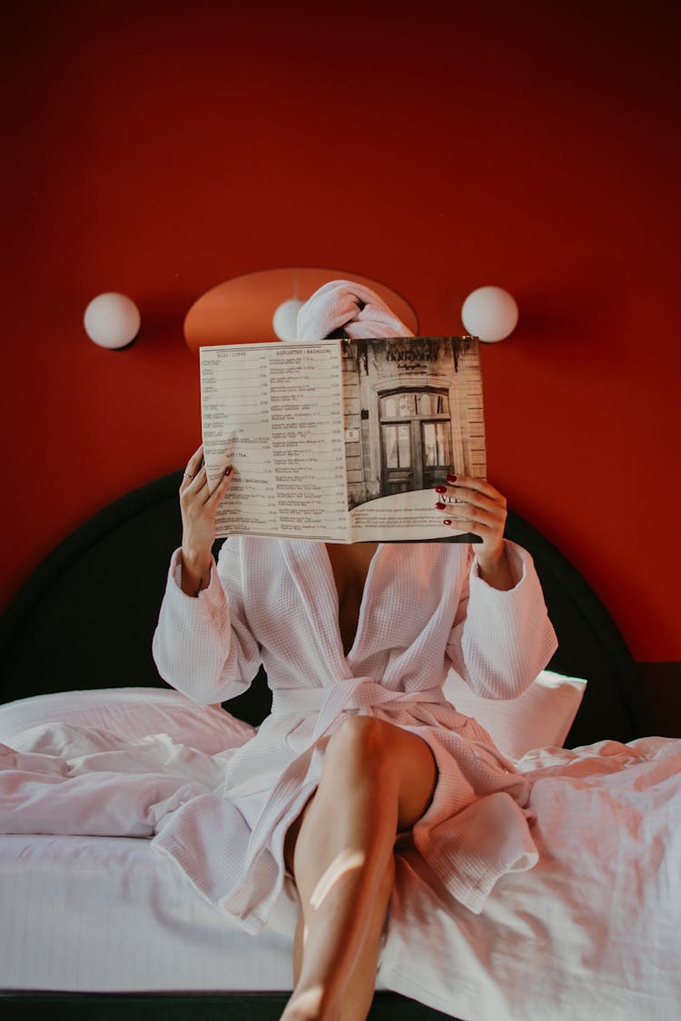 A Woman Reading A Magazine 