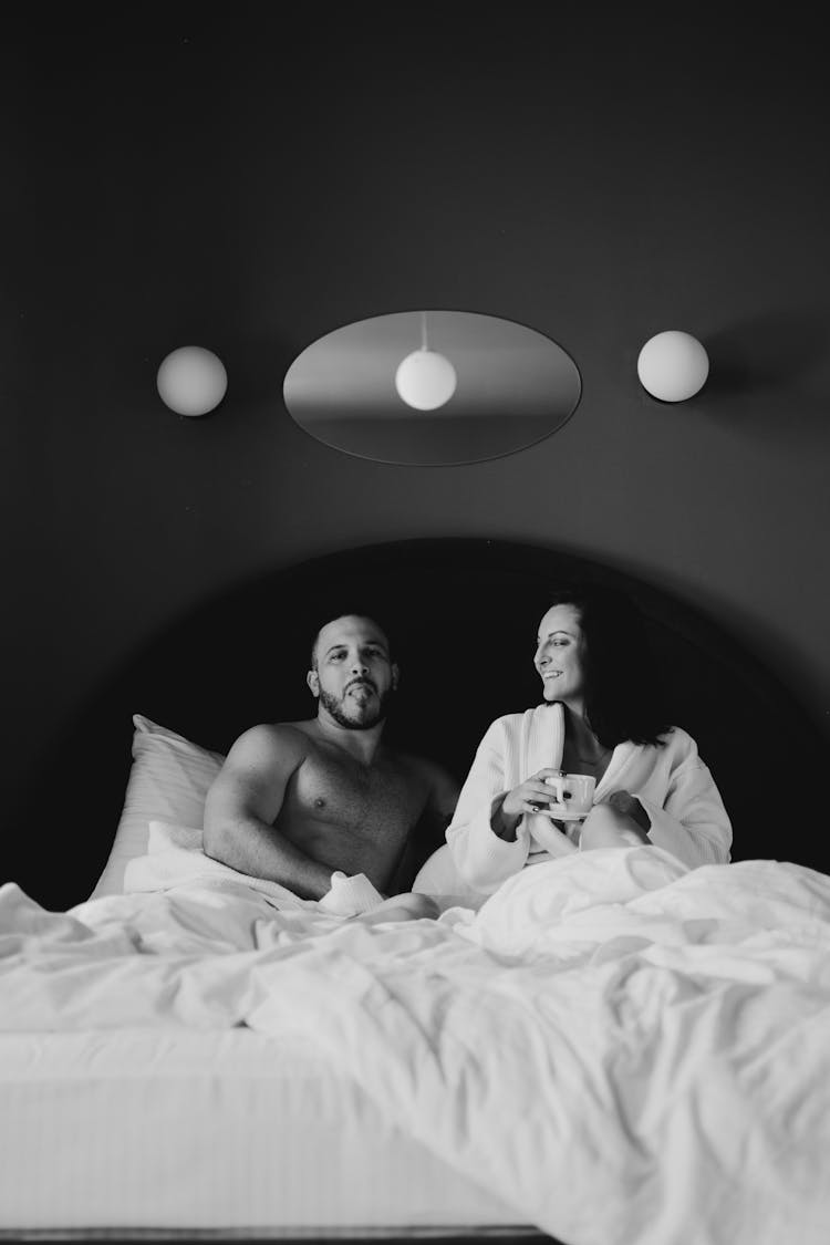 A Couple Staying In Bed