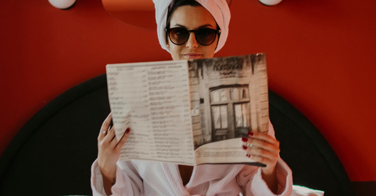 The Reading Robe A Woman in a Robe Reading a Magazine · Free Stock Photo