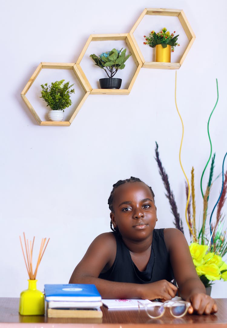 A Young Girl Studying At Indoors