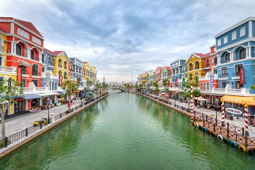 Free Vibrant buildings line a canal in Phu Quoc, Vietnam, showcasing colorful architecture. Stock Photo