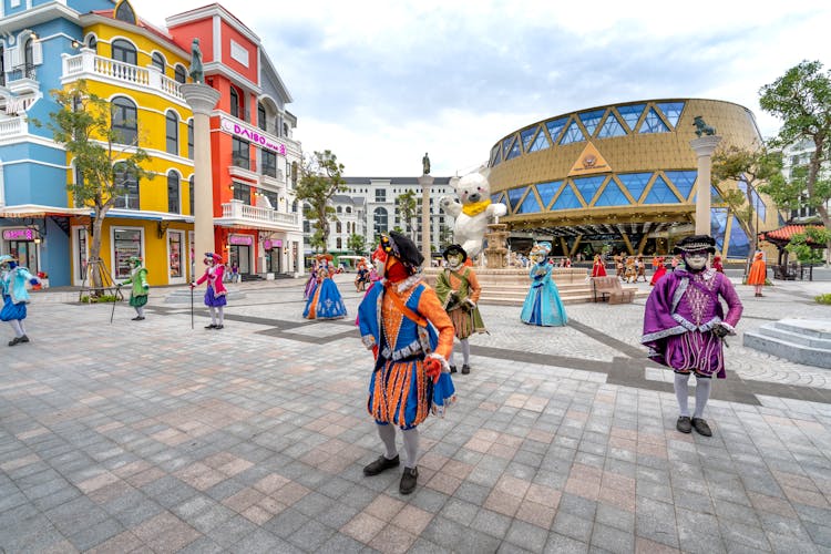 People In Costumes Dancing At City Square