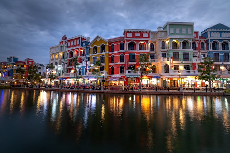 A Row Of Colorful Buildings Near The Canal 