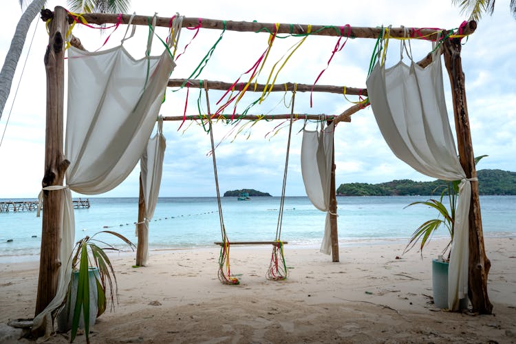 Wooden Swing On Beach Shore