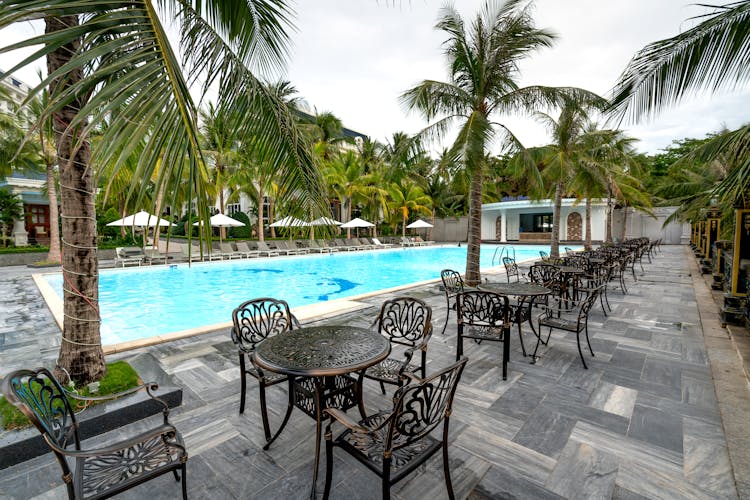 Tables And Chairs Near Swimming Pool