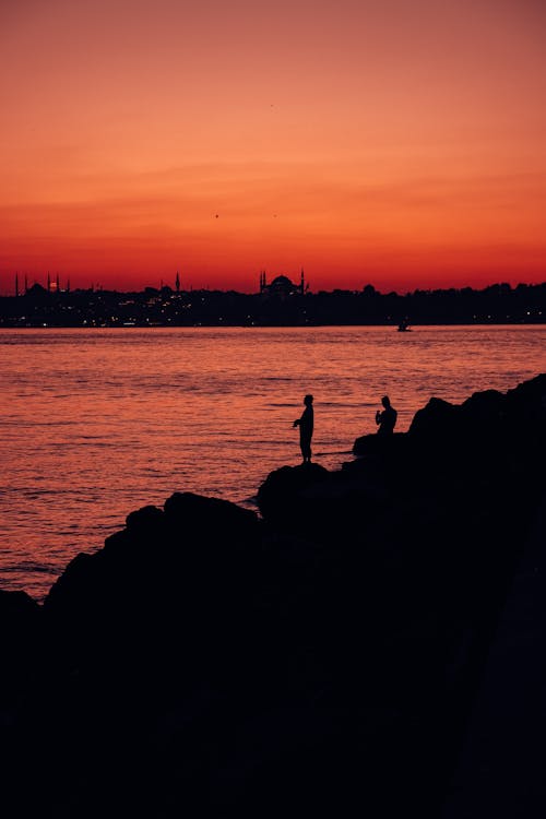 Photos gratuites de ciel orange, heure dorée, mer