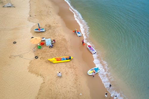 Free Birds Eye View of Boats on the Beach and Sea  Stock Photo