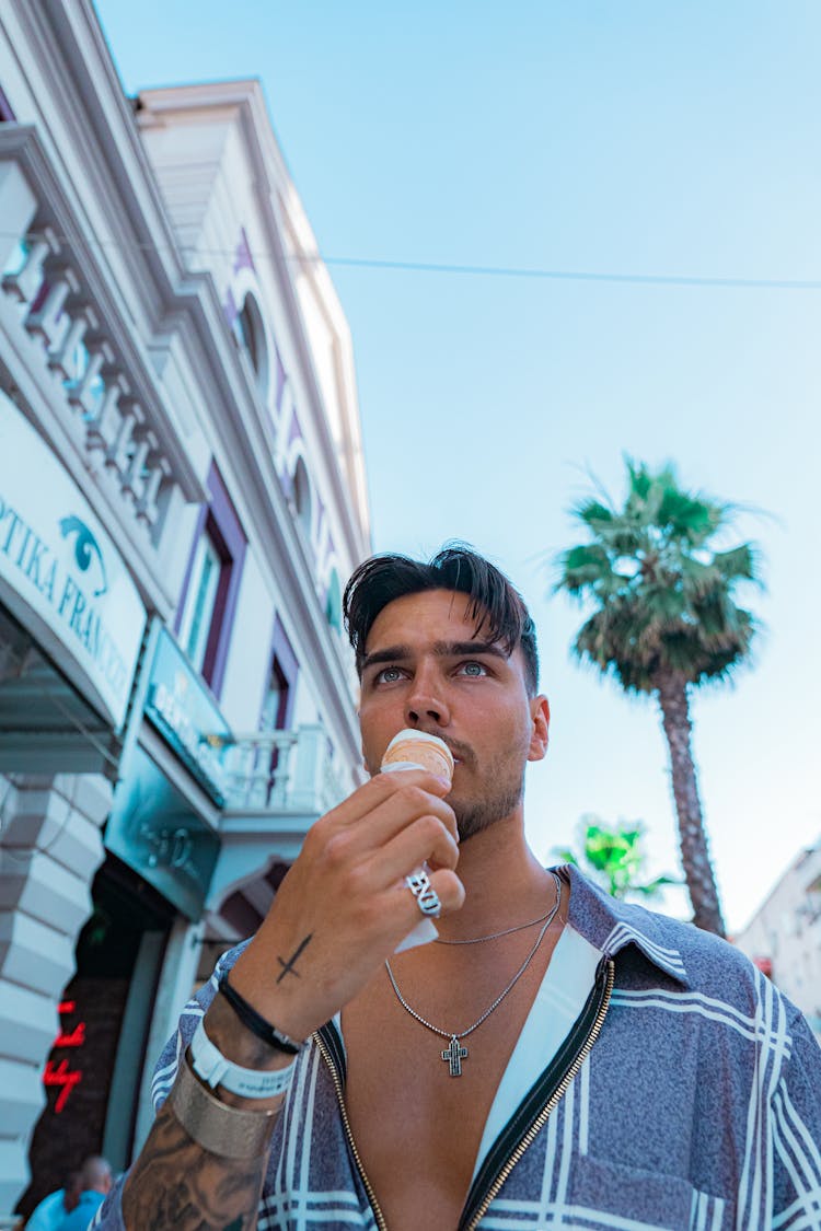 Man In Gray Shirt Eating Ice Cream On Cone