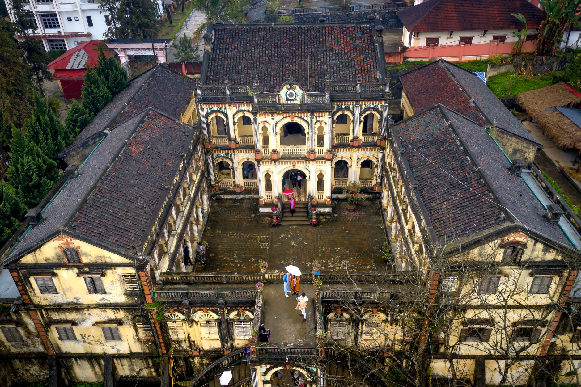 Aerial shot of historical Dinh Hoang A Tuong Palace showcasing its unique architecture.