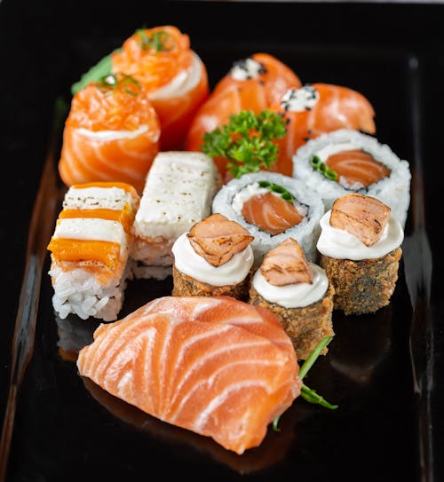 Close-Up Photo of Sushi on Black Plate