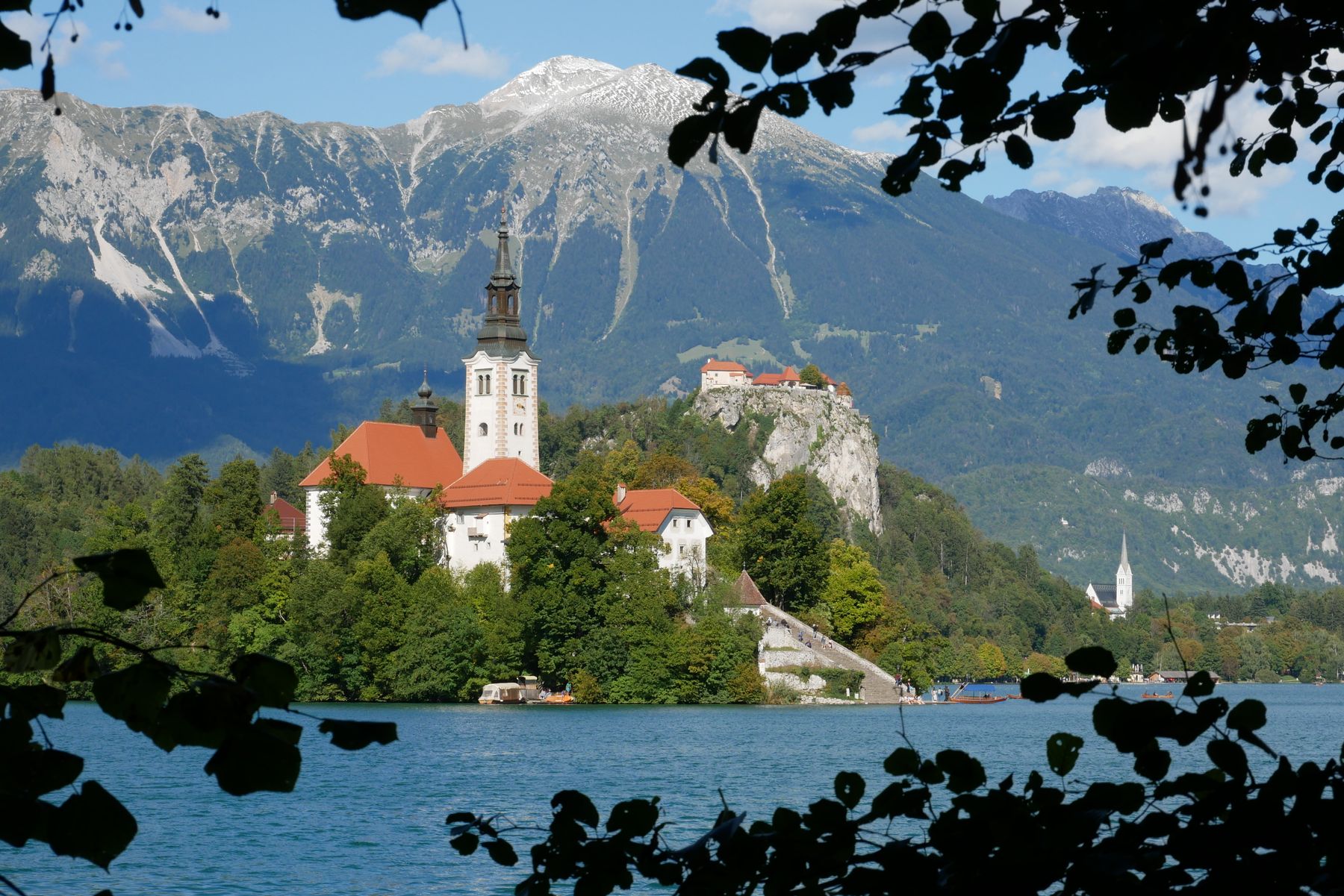 Bled Island and church surrounded by the lake and mountains