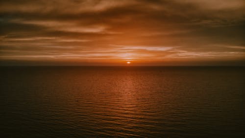 Drone Photography of Calm Ocean during Sunset