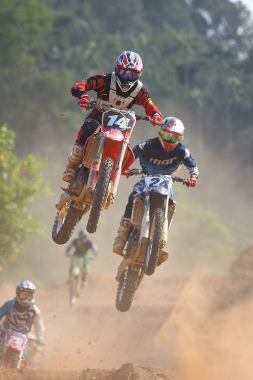 Two People Riding on Dirt Bike