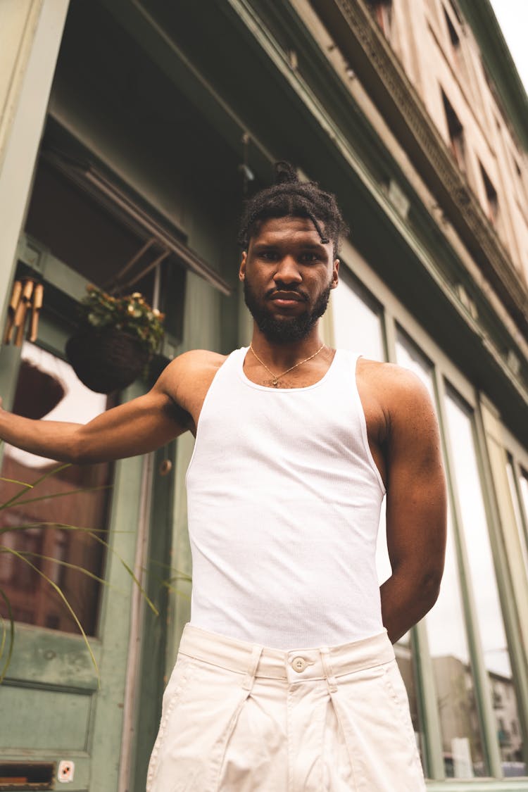 A Man In A White Tank Top 