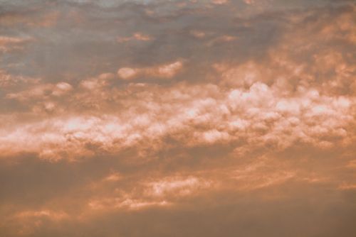 Free Beautiful peach-colored clouds during sunset in Guaratuba, Brazil, capturing serene evening sky beauty. Stock Photo