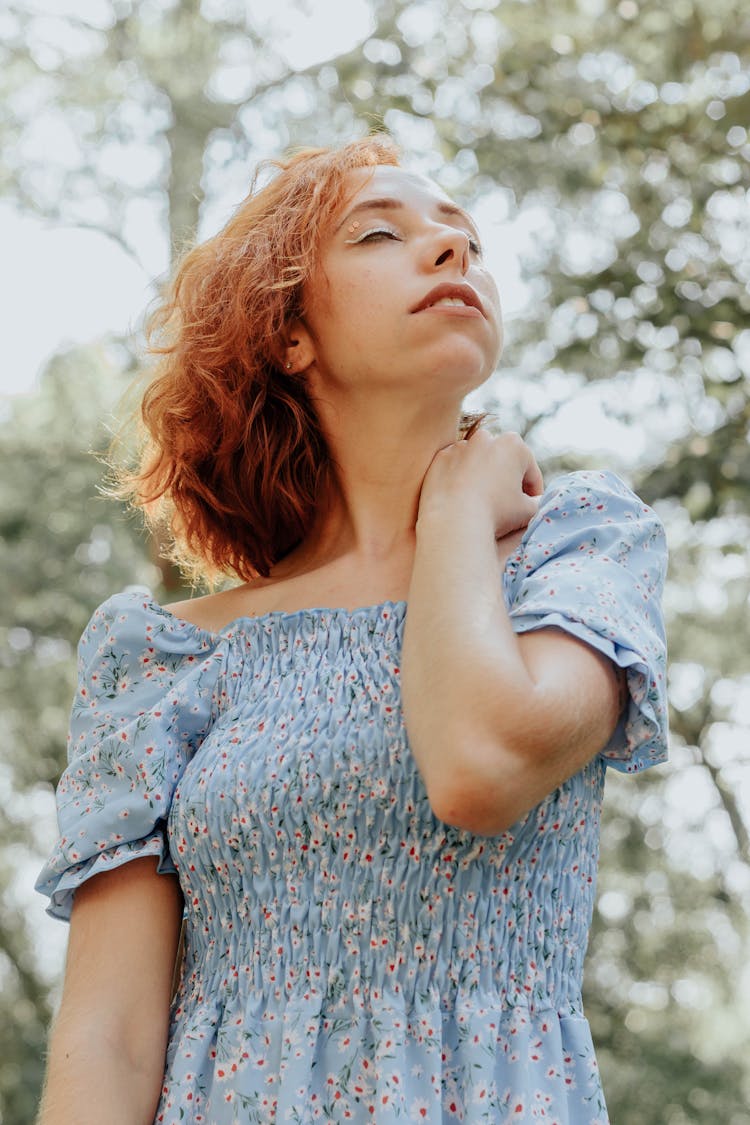 Young Redhead Woman In A Dress