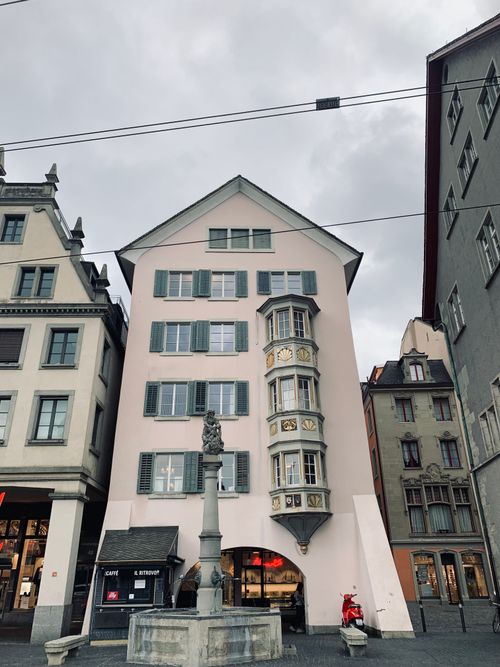 Free Historic buildings in Zürich's old town, highlighting unique architecture and overcast skies. Stock Photo