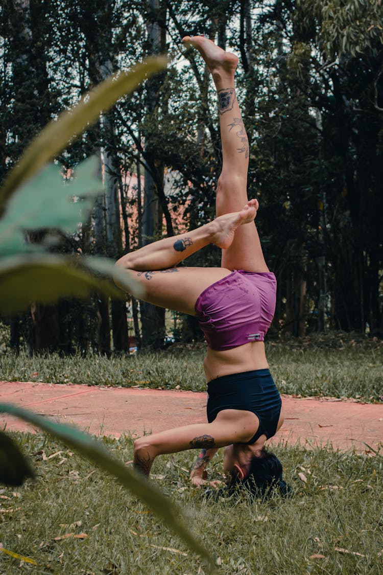 Woman Doing Yoga On The Lawn 