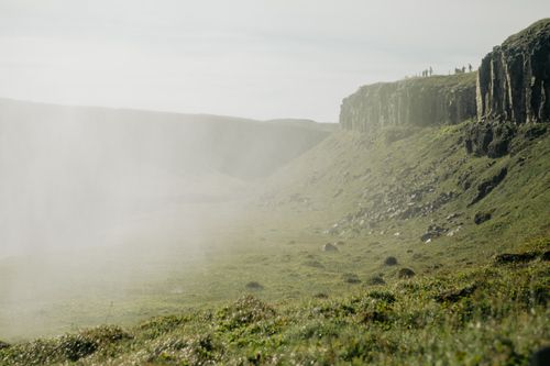Free Stunning view of a misty cliffside with fog enveloping the serene landscape, perfect for nature enthusiasts. Stock Photo