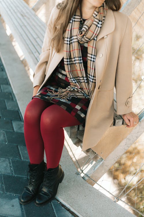 Woman Wearing Trench Coat on a Pier 