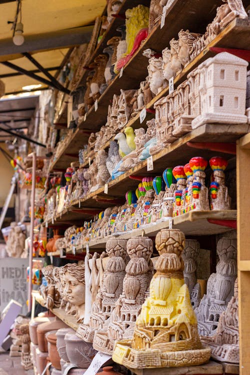 Assorted Souvenirs Displayed on Wooden Rack