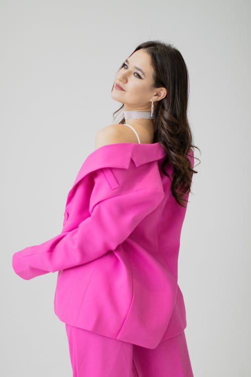 Female Model Posing in a Vibrant Pink Jacket