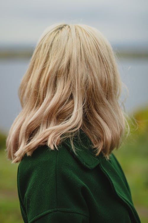 Blonde Haired Woman in Green Blazer