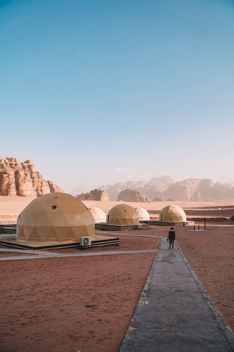 Camp Tents In Desert Landscape