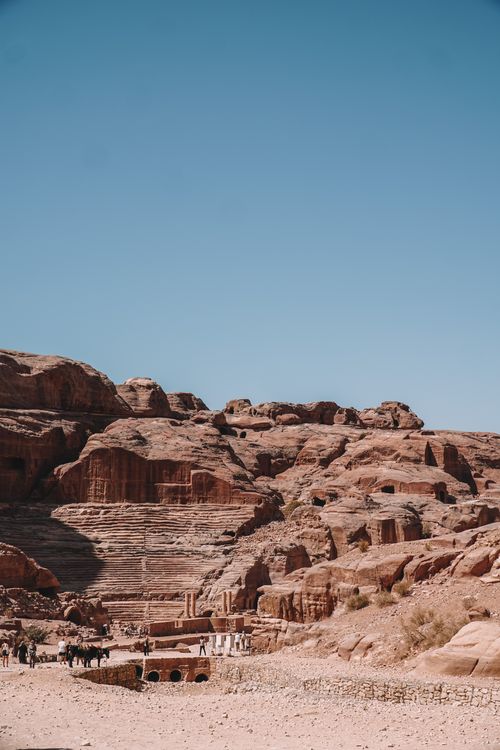 Free Explore the ancient sandstone formations of Petra under a clear blue sky. Stock Photo
