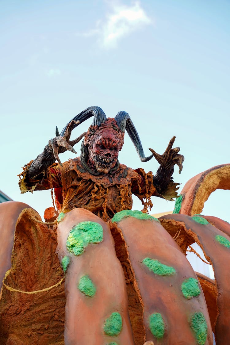 Sculpture Of A Devil Coming Out Of A Pumpkin 