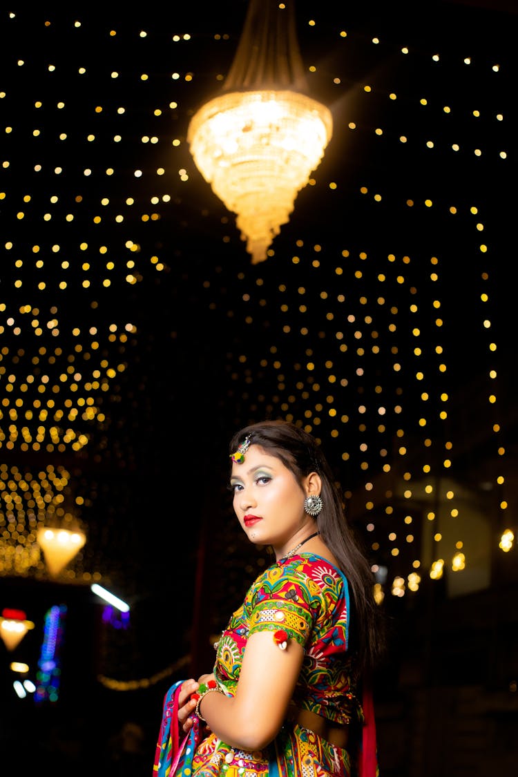 Young Woman In Colorful Traditional Clothing On A Party 