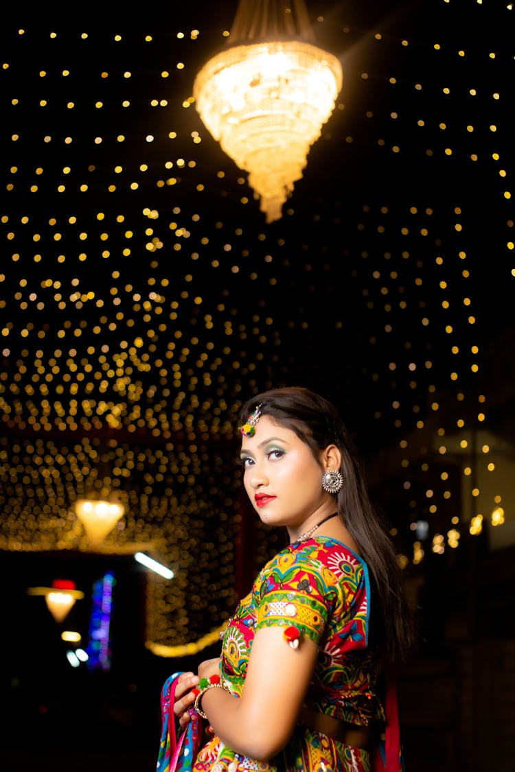 Young Woman In Colorful Traditional Clothing On A Party 