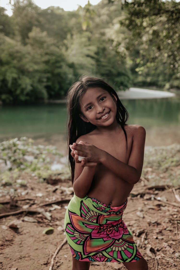 A Shirtless Girl Wearing Floral Skirt 