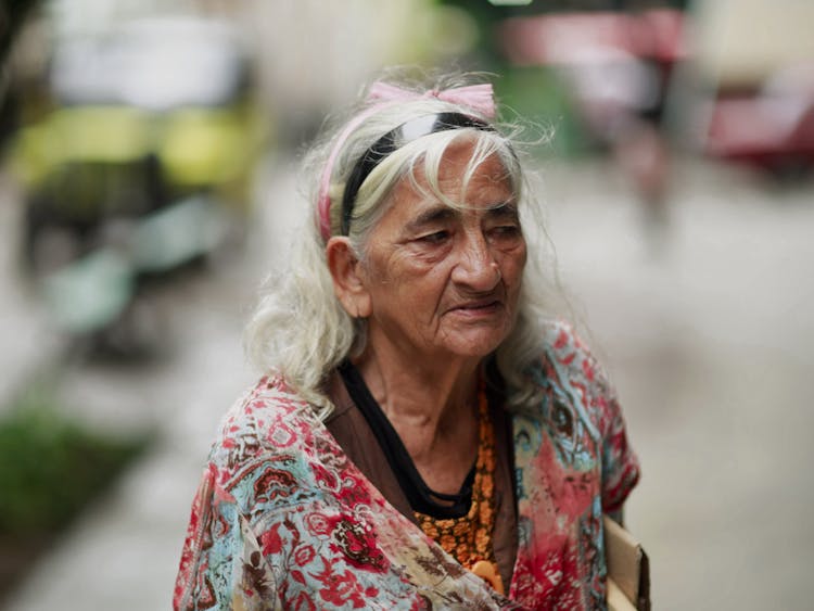 Candid Picture Of An Elderly Woman On A Street