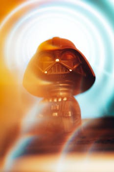 Miniature Darth Vader figurine with vibrant light effects adds a touch of fantasy.