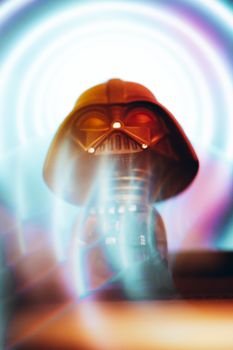 Darth Vader helmet in vibrant sci-fi lighting, creating an otherworldly effect.