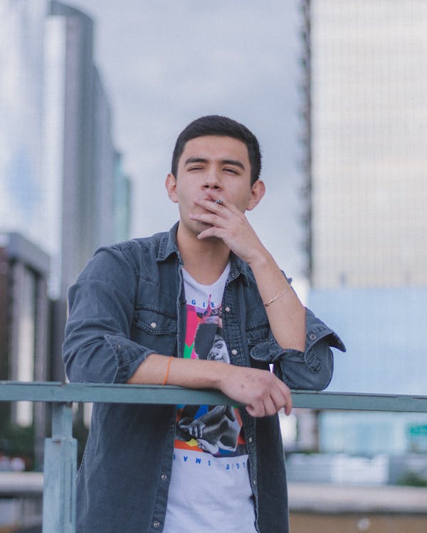 A Young Man Smoking a Cigarette