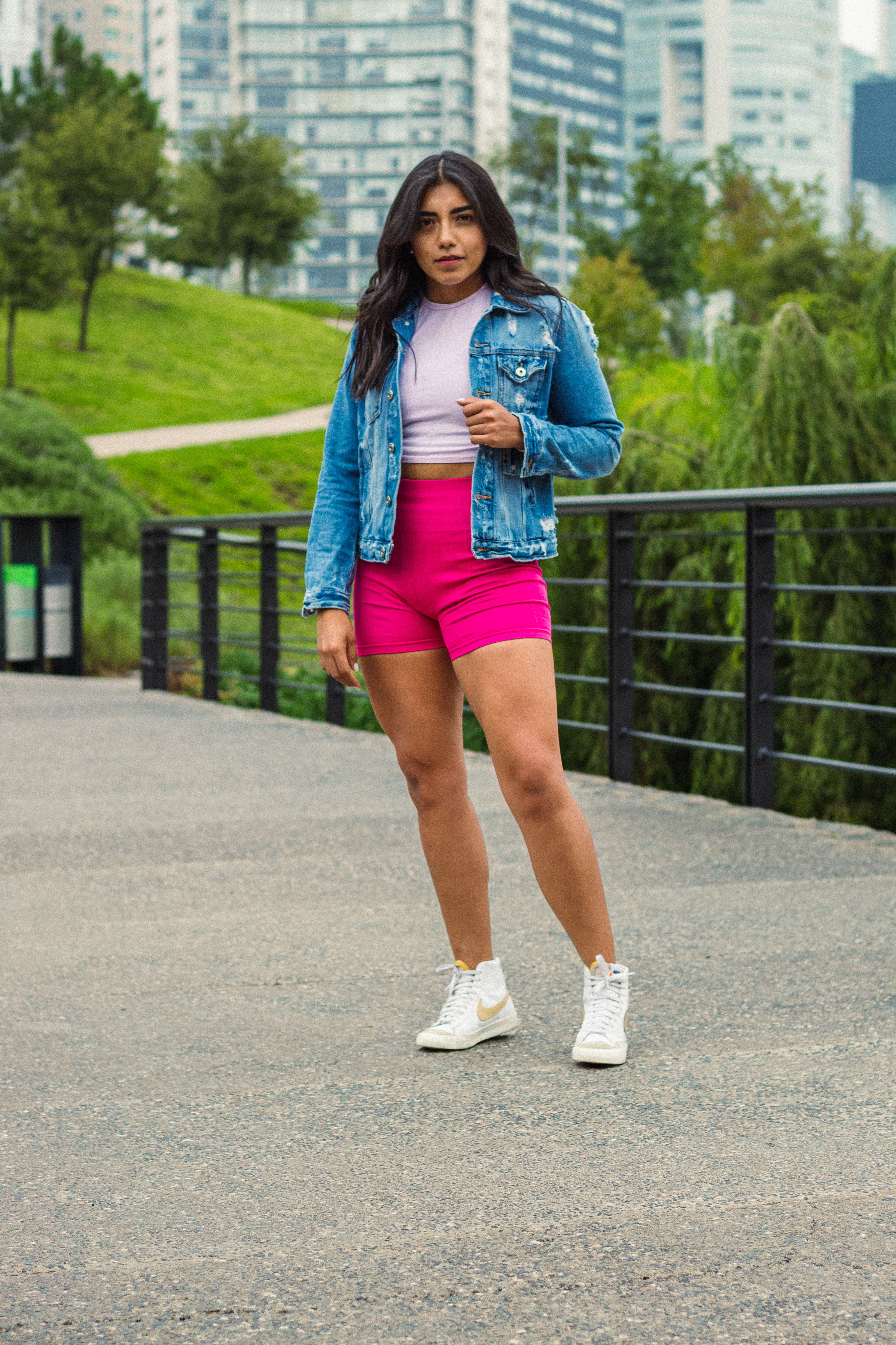 A Woman in Denim Jacket and Pink Shorts · Free Stock Photo