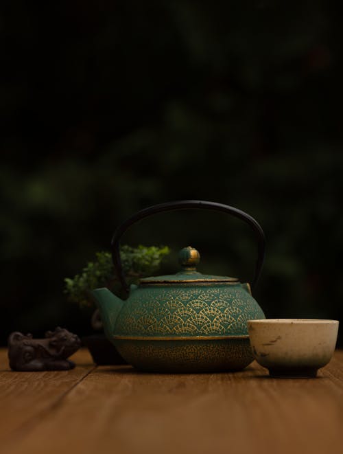 Old-fashioned Teapot on Wooden Table