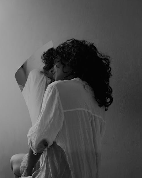 Free Monochrome Photo of a Woman Holding a Mirror Stock Photo