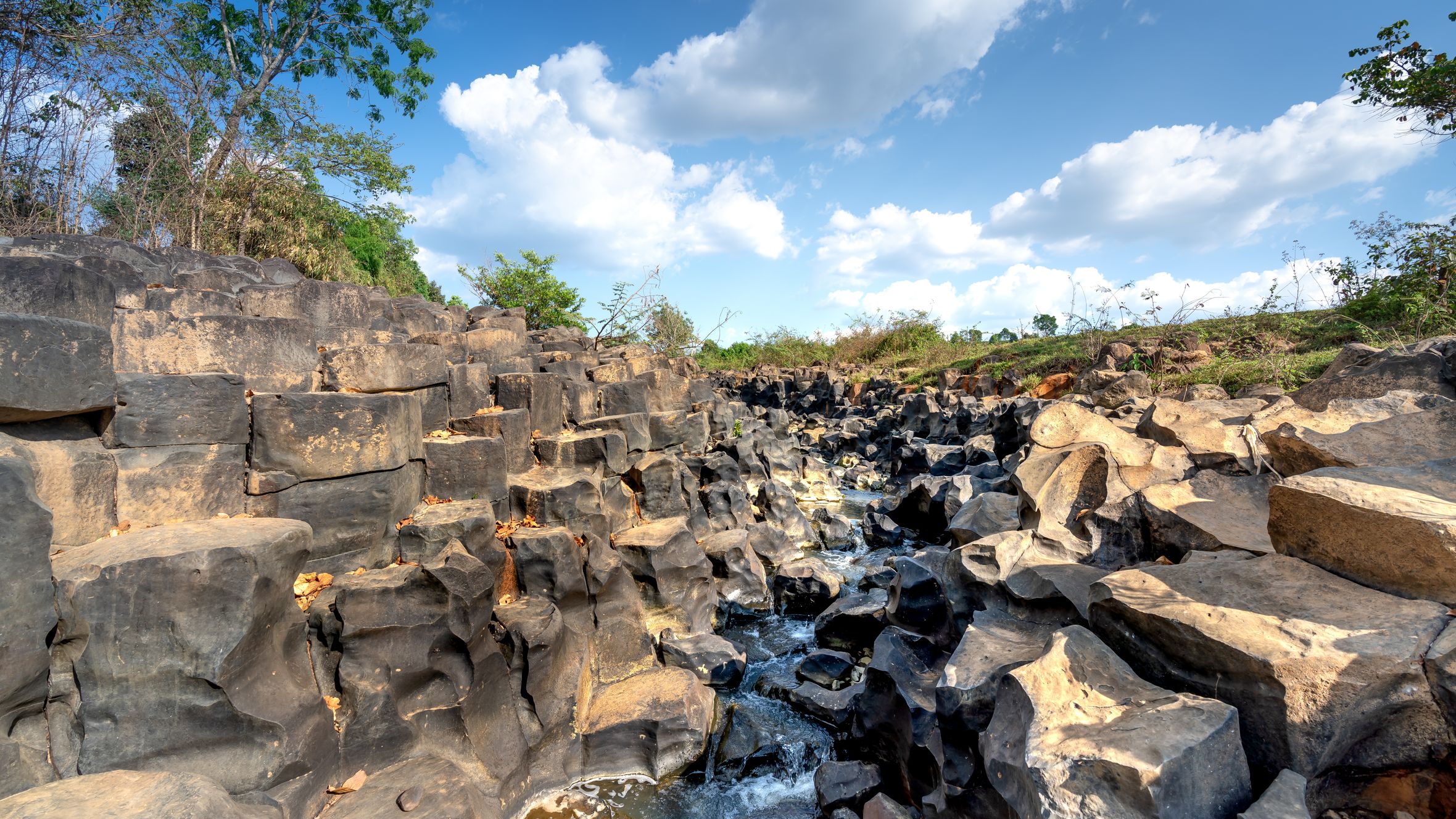 Flowing water through unique rock formations in Gia Lai Province, Vietnam.