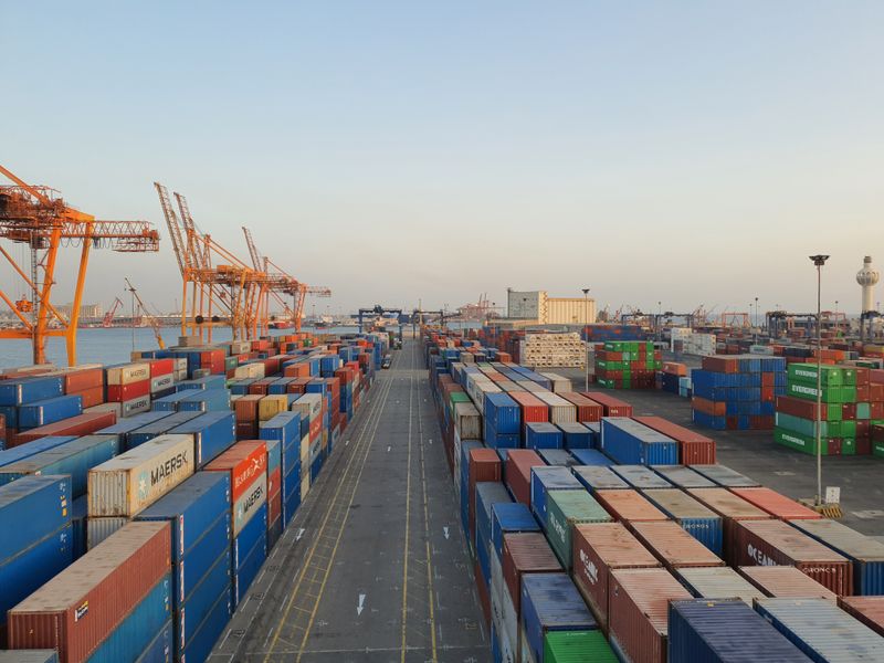 warehouse operations team mapping freight lanes on logistics planning board