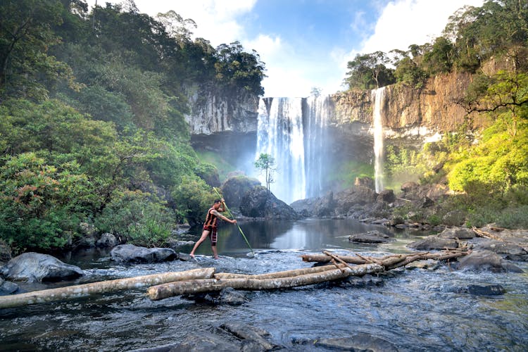 Man Fishing With A Spear