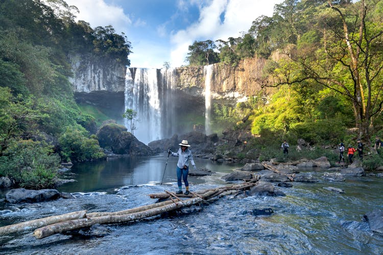 Person On An Adventure In The Forest With Waterfalls